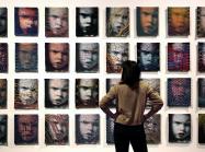 A wall of 32 woven portraits 