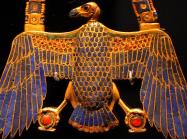 egyptian pectoral amulet in the shape of a vulture, made in gold with lapis lazuli inlay