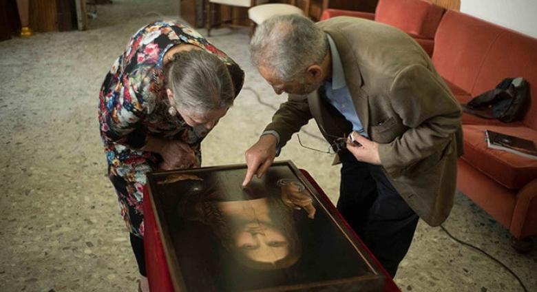 Dianne Modestini and Ashok Roy inspecting the Naples copy of the Salvator Mundi (2019)