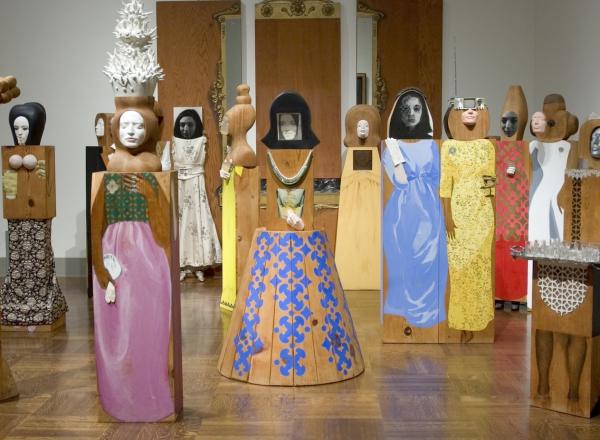 Marisol, The Party, 1965-66. Assemblage of 15 freestanding, life-size figures and 3 wall panels, with painted wood and carved wood, mirrors, plastic, television set, clothes, shoes, glasses, and other accessories. Dimensions variable. 