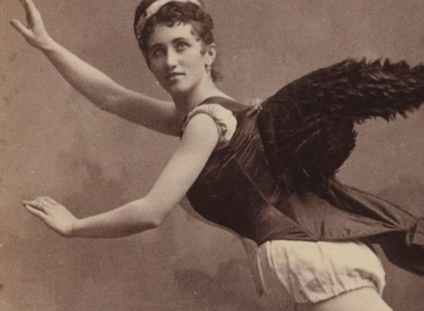 sepia photograph of a woman in angel costume