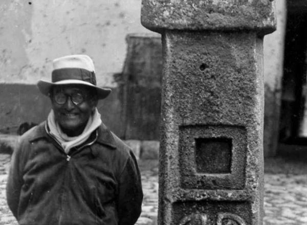 Detail of Peruvian archaeologist Julian C. Tello photographed standing next to the Tello Obelisk, named for his discovery.