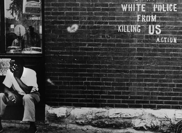 Darryl Cowherd. Stop White Police from Killing Us – St. Louis, MO, c. 1966-67. Gelatin Silver Print. Image: 15 x 19 in., mat: 20 x 24 ¼ in., paper 16 x 20 in.