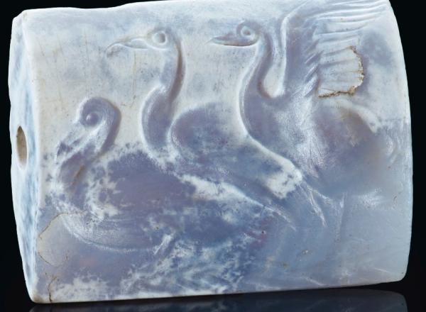 A Minoan Blue Chalcedony Tabloid Seal with Three Swans Late Palace Period, circa 16th century B.C.