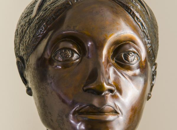 bronze bust of woman's head